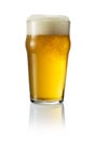 Glass of blonde beer with foam Royalty Free Stock Photo
