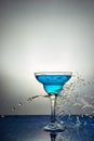 Glass with blue champagne or cocktail. Levitation Royalty Free Stock Photo