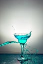 Glass with blue champagne or cocktail. Levitation Royalty Free Stock Photo