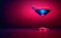 Glass with blue cocktail and pink neon light,isolated on dark red background,copy space Royalty Free Stock Photo