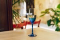 Glass of blue color with champagne table i Royalty Free Stock Photo