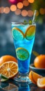 A glass of blue liquid with a straw in it and a bunch of oranges Royalty Free Stock Photo