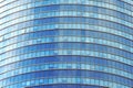 Glass blue square Windows of facade modern city business building skyscraper. Modern apartment buildings in new neighborhood. Royalty Free Stock Photo