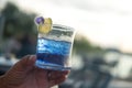 A glass of blue and violet color butterfly pea flower juice drinking, decorate with lemon fruit slices Royalty Free Stock Photo