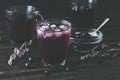 Glass with Blueberry Juice on dark wooden table Royalty Free Stock Photo