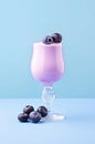 Glass of blueberry milk cocktail.