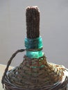 Glass bottle antique Wicker-clad to hold wine and oil