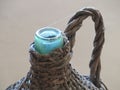 Glass bottle antique Wicker-clad to hold wine