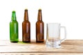 Glass and bottle of beer with no logos on wooden table isolated copy space, bottle mock up. Beer bottle studio shot with cap Royalty Free Stock Photo