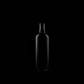 Minimalistic Symmetry: Captivating Glass Bottle On Dark Background