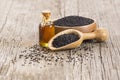 Glass bottle of black cumin seeds essential oil , Nigella Sativa Royalty Free Stock Photo