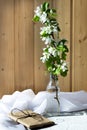 Glass bottle with blossoming branches of cherry, Royalty Free Stock Photo