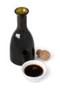 Glass bottle and bowl with traditional Italian Balsamic vinegar on white background