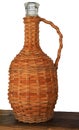 Glass bottle in a braid for homemade wine Royalty Free Stock Photo