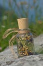 Glass bottle with dried herbs