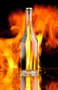 Glass bottle and flame Royalty Free Stock Photo