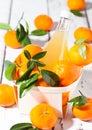 Glass bottle of fresh mandarin tangerine juice Royalty Free Stock Photo