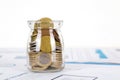 Glass bottle full of coins Royalty Free Stock Photo