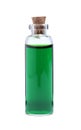 Glass bottle of green food coloring on white background Royalty Free Stock Photo