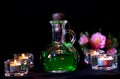 Glass bottle with green potion on dark background. Royalty Free Stock Photo