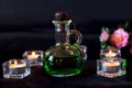 Glass bottle with green potion on dark background. Royalty Free Stock Photo