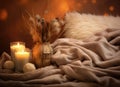 A glass bottle of home perfume stands adorned with wooden sticks, emanating a soothing fragrance. Scented candles emit