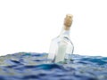 Glass bottle with letter in the sea Royalty Free Stock Photo