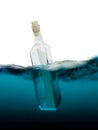 Glass bottle with letter in the sea Royalty Free Stock Photo