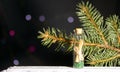 Glass bottle with a note inside and a fir branch. A note in the form of rolled up paper bound in a rope. Beads are poured at the