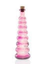 Glass bottle pink with cork stopper isolated Royalty Free Stock Photo