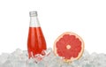 Glass bottle of pink grapefruit drink on ice Royalty Free Stock Photo