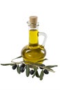 Glass bottle of premium olive oil and some ripe olives with a branch