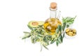 Glass bottle of premium virgin olive oil, avocado, rosemary and some olives with olive branch