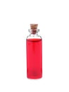 Glass bottle of red food coloring on white background Royalty Free Stock Photo