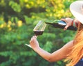 Woman pouring red wine at vineyard Royalty Free Stock Photo