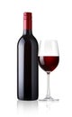 Glass and bottle of red wine on white background