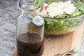 a glass bottle with salad dressing consisting of balsamic vinegar, honey and olive oil Royalty Free Stock Photo