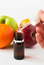 cosmetic concept, glass bottle with serum with alpha hydroxy acids on a background of fruit