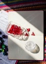 Glass bottle with 4-sided dice on a open notebook Royalty Free Stock Photo