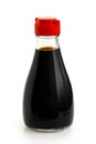 Glass bottle of soya sauce with red plastic lid isolated on whit