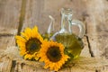 Glass bottle with sunflower oil and sunflowers Royalty Free Stock Photo