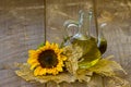 Glass bottle with sunflower oil and sunflowers Royalty Free Stock Photo