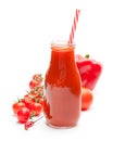 Glass bottle with tomato juice and cherry tomatoes isolated on Royalty Free Stock Photo