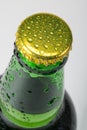 A glass bottle with water drops, a close-up. Alcohol drinks Royalty Free Stock Photo