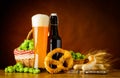 Glass and Bottle Wheat Beer with Prezel and Sausage Royalty Free Stock Photo