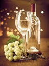 Glass and bottle of white wine with fresh grapes Royalty Free Stock Photo