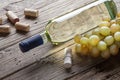 Glass bottle of wine with corkscrew on wooden table background Royalty Free Stock Photo