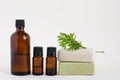 glass bottles of brown color and two bars of natural soap on a white isolated background. natural self-care. Mockup beauty Royalty Free Stock Photo