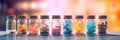 Glass bottles with colorful medicine. Liquid potions and candy in jars. Medical dose medication. Royalty Free Stock Photo