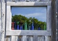 Old wood window with color bottles Royalty Free Stock Photo